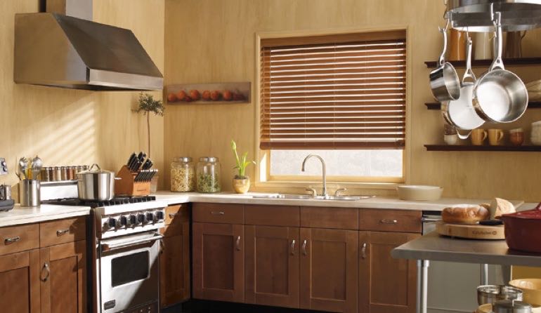 Raleigh kitchen faux wood blinds.